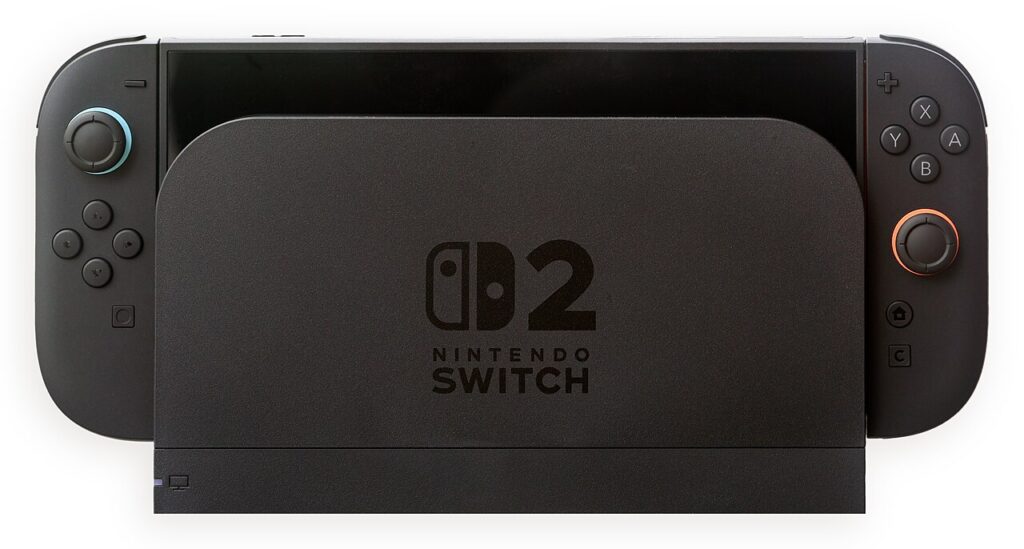 양쪽 조이콘이 장착된 Nintendo Switch 2 본체가 검은색 독에 꽂힌 정면 모습